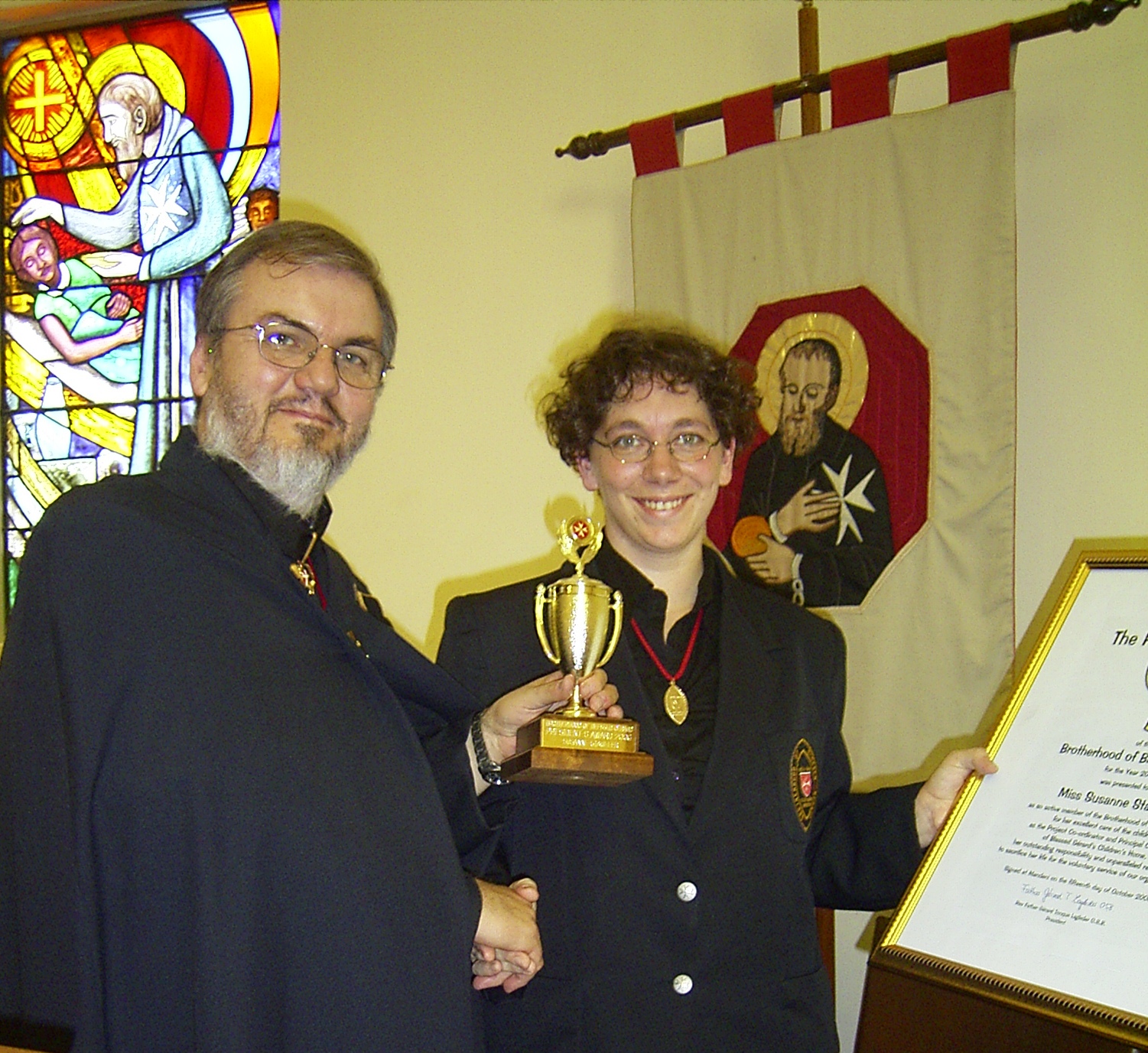 Father Gérard presenting the President’s Award trophy and certificate to Susanne Stauffer in 2006