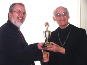 Father Gérard presenting the President’s Award trophy to Abbot Godfrey Sieber on 16 October 2011