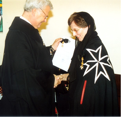 Frà Ludwig Hoffmann von Rumerstein promoting Clare Kalkwarf from Donat of Devotion to Dame of Magistral Grace on 15 December 2002