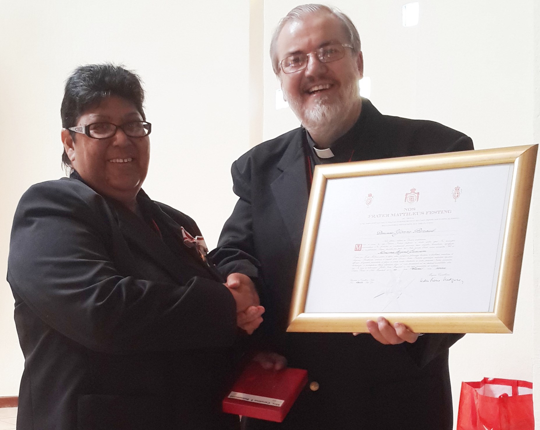 Caroline Beaumont receiving the Cross pro Merito Melitensi